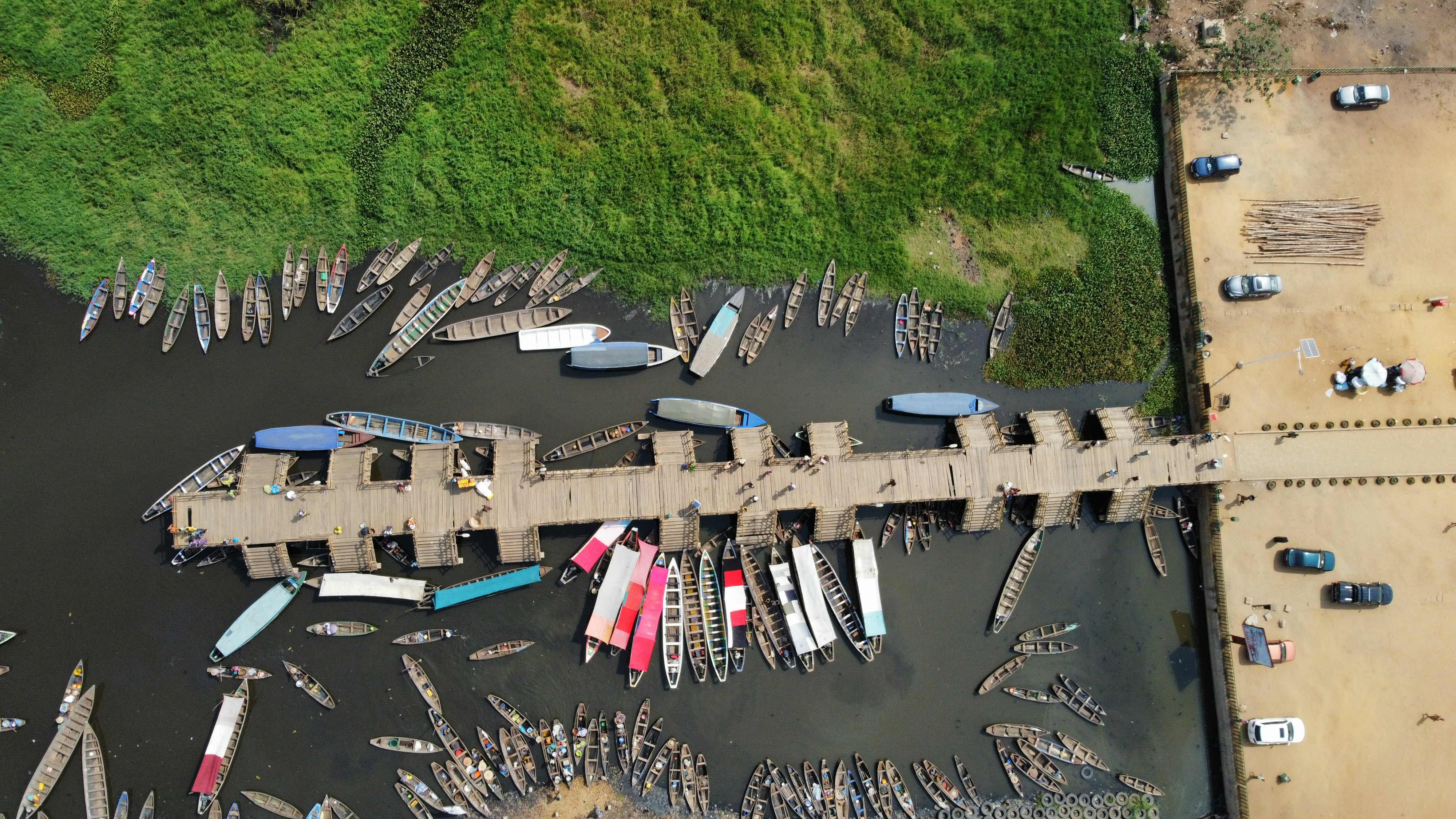 a group of people standing on a beach, 