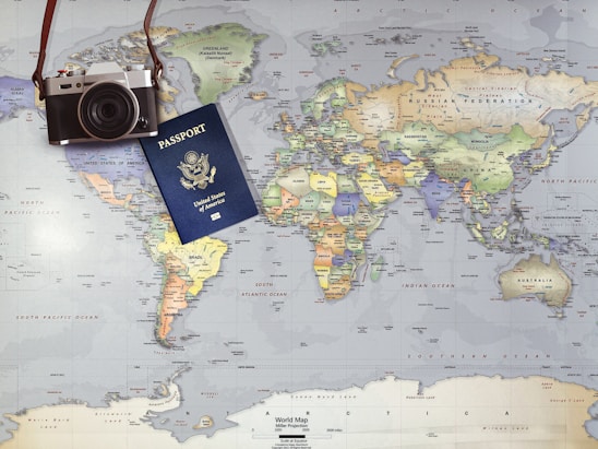 Globe and passport representing worldwide travel and vacation planning.