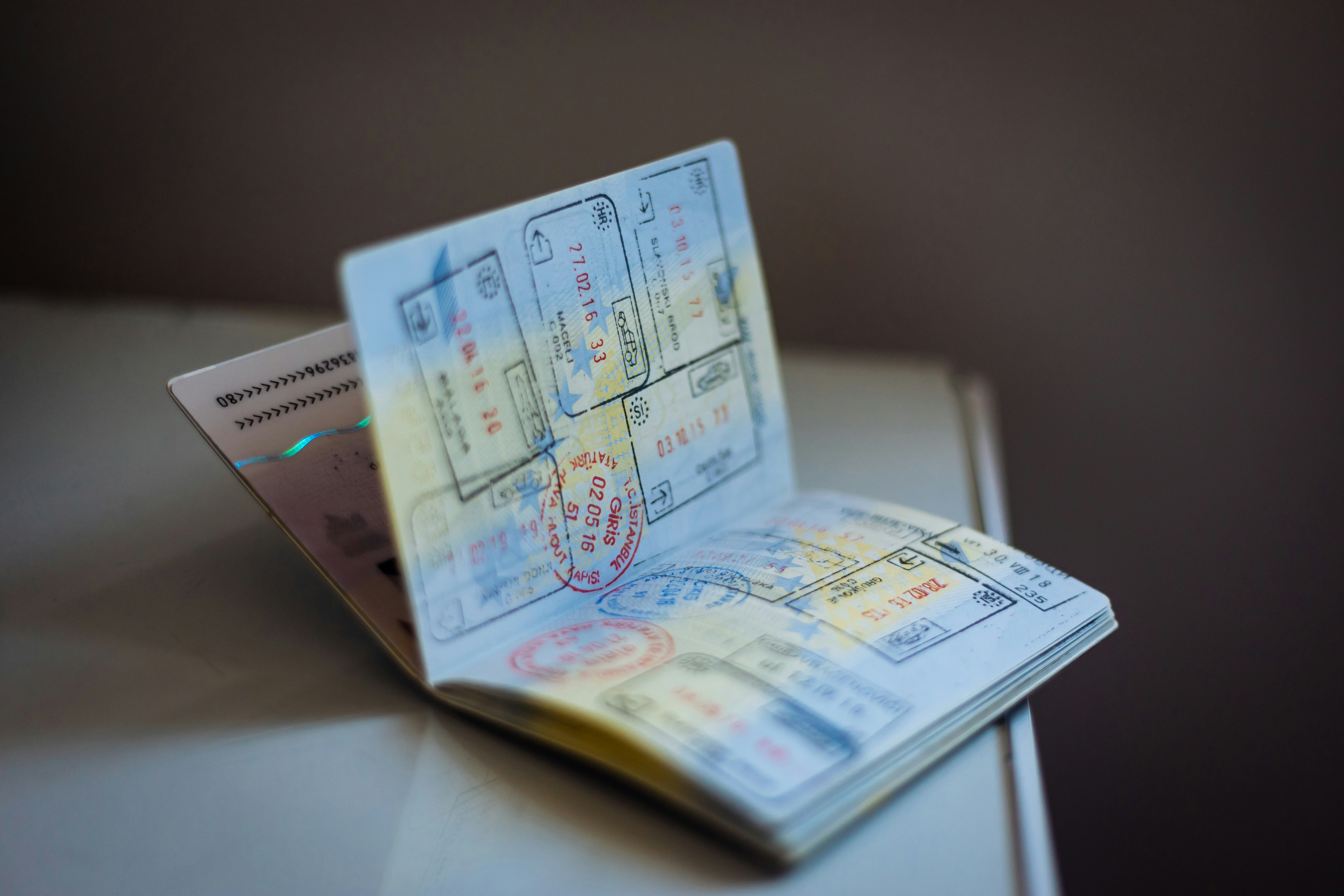 An open passport containing multiple stamps.