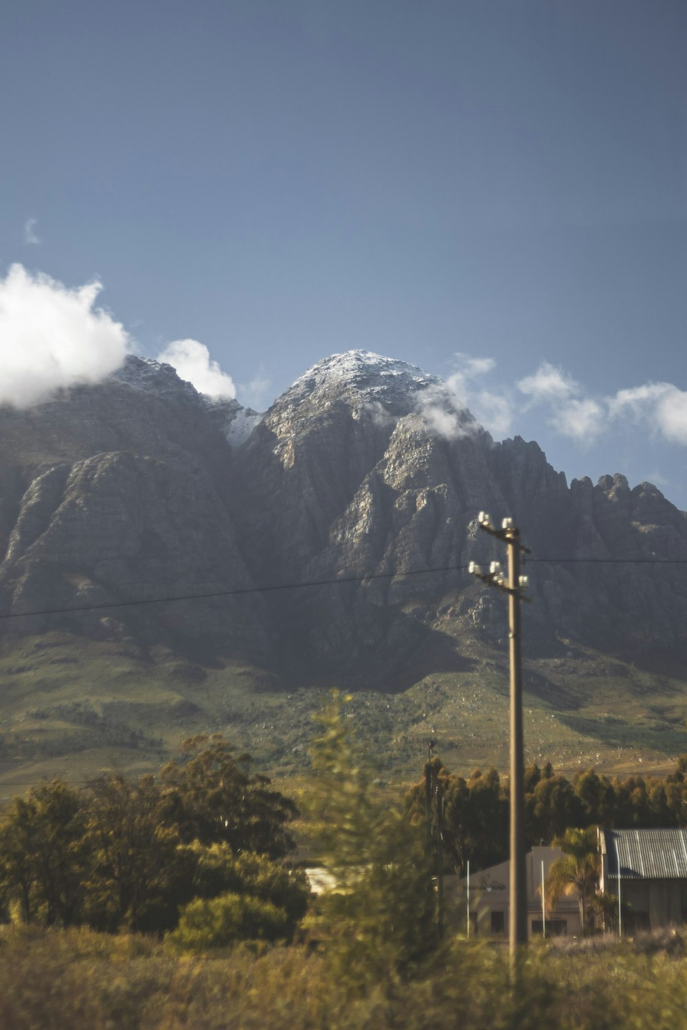 a mountain with clouds