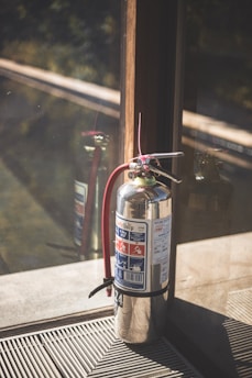 a fire extinguisher on a window sill