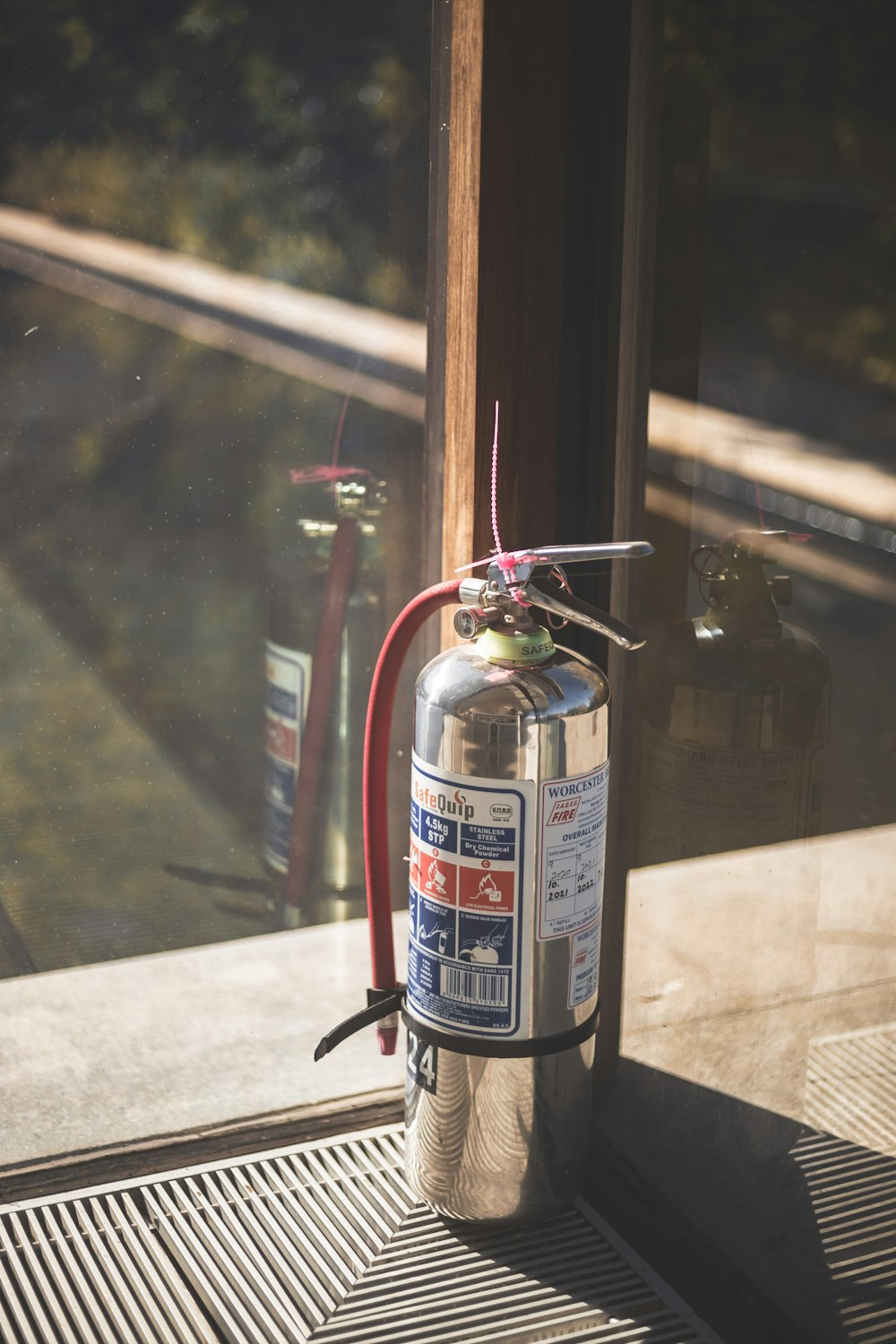 a fire extinguisher on a window sill