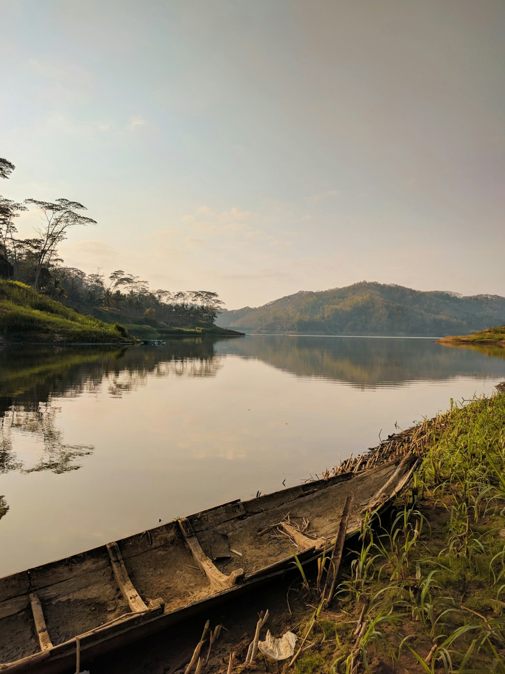 a wooden boat on a lake