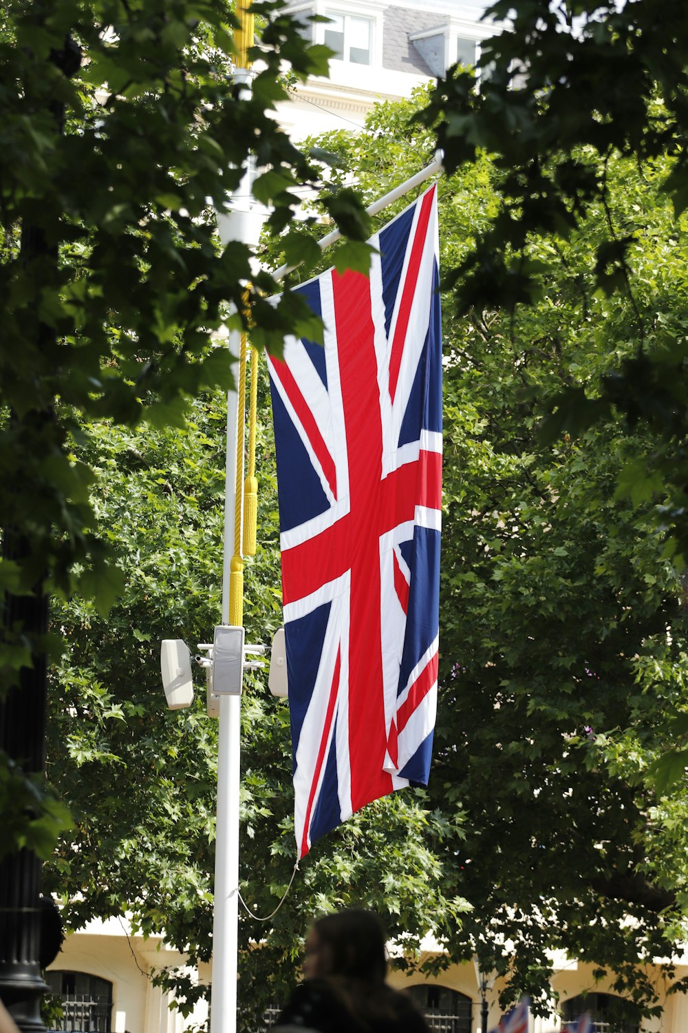 a group of flags on poles