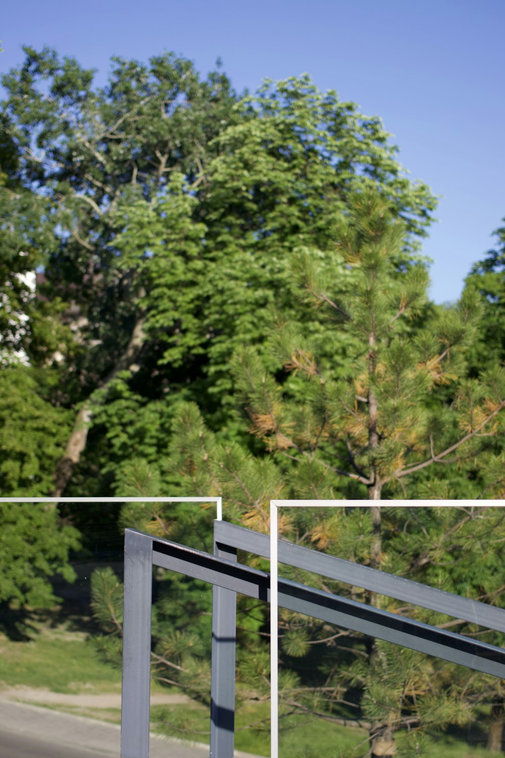 a wooden fence with trees in the background