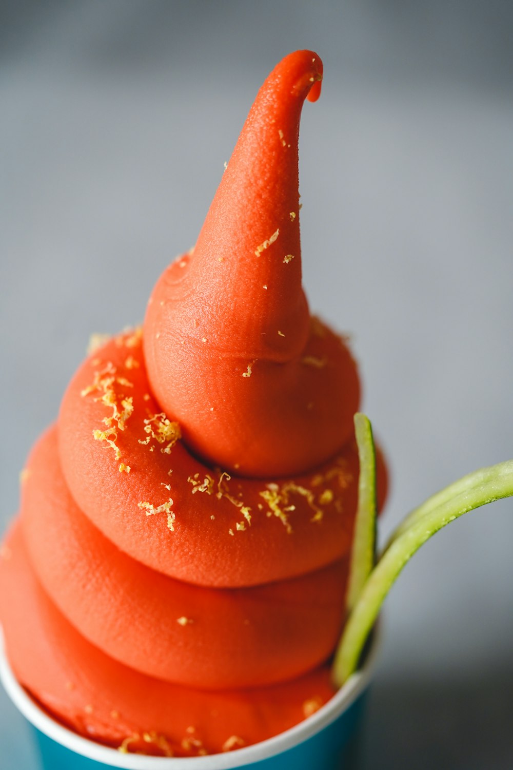 a red pepper with a green stem