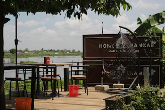 Inviting seating area with comfortable chairs and a view of the peaceful riverbank.