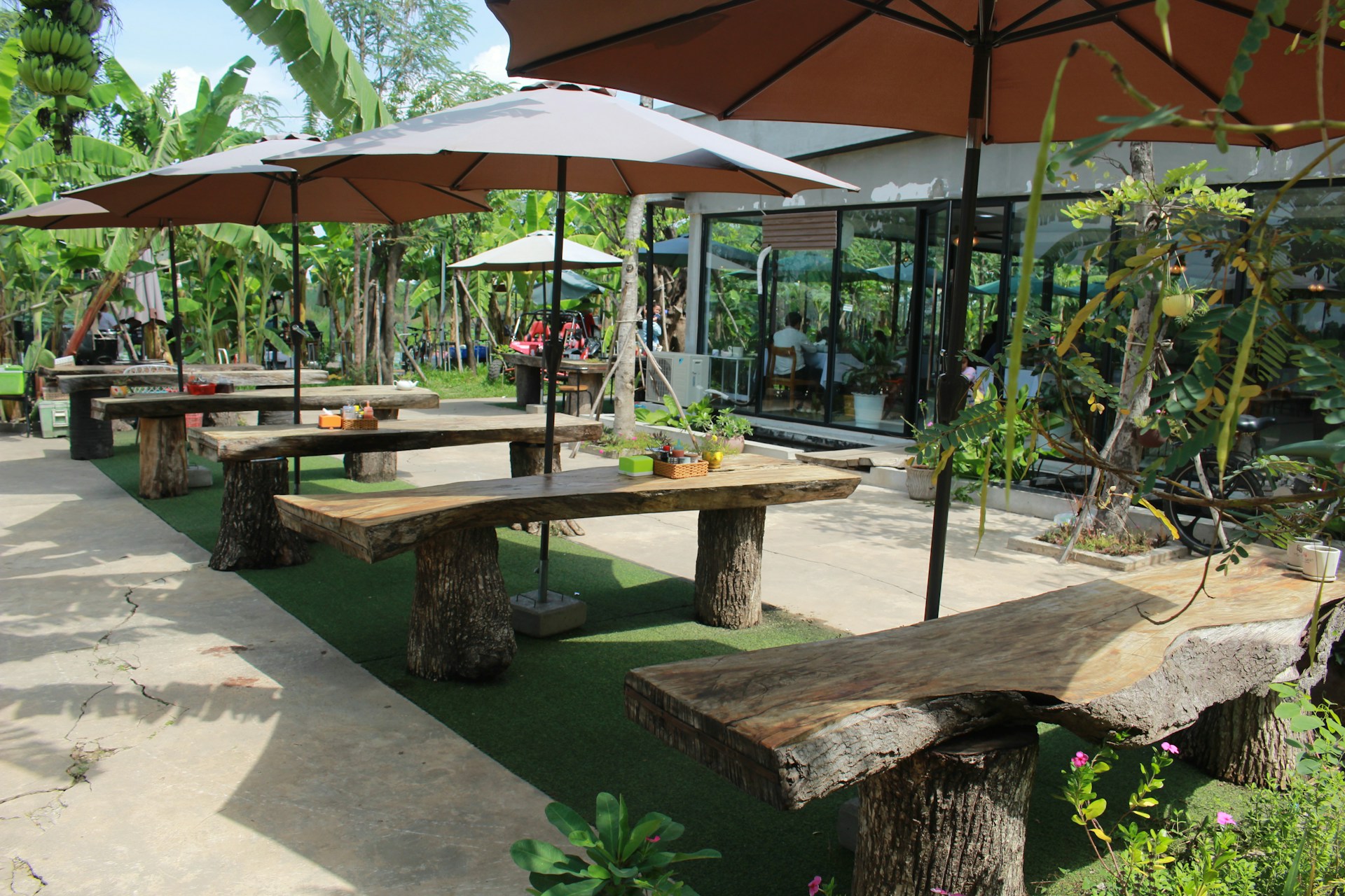 a bench sits under an umbrella
