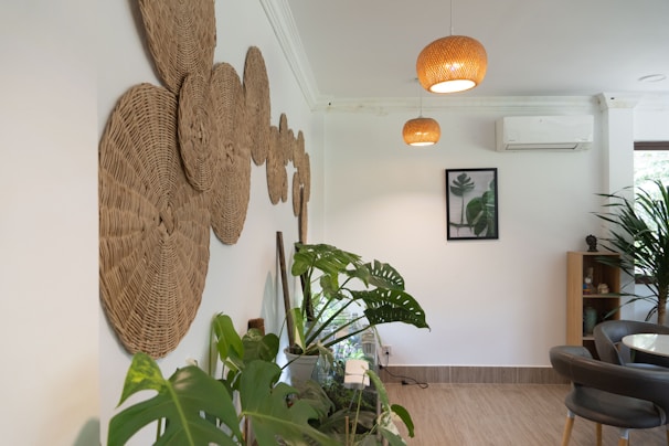 a room with a chandelier and plants
