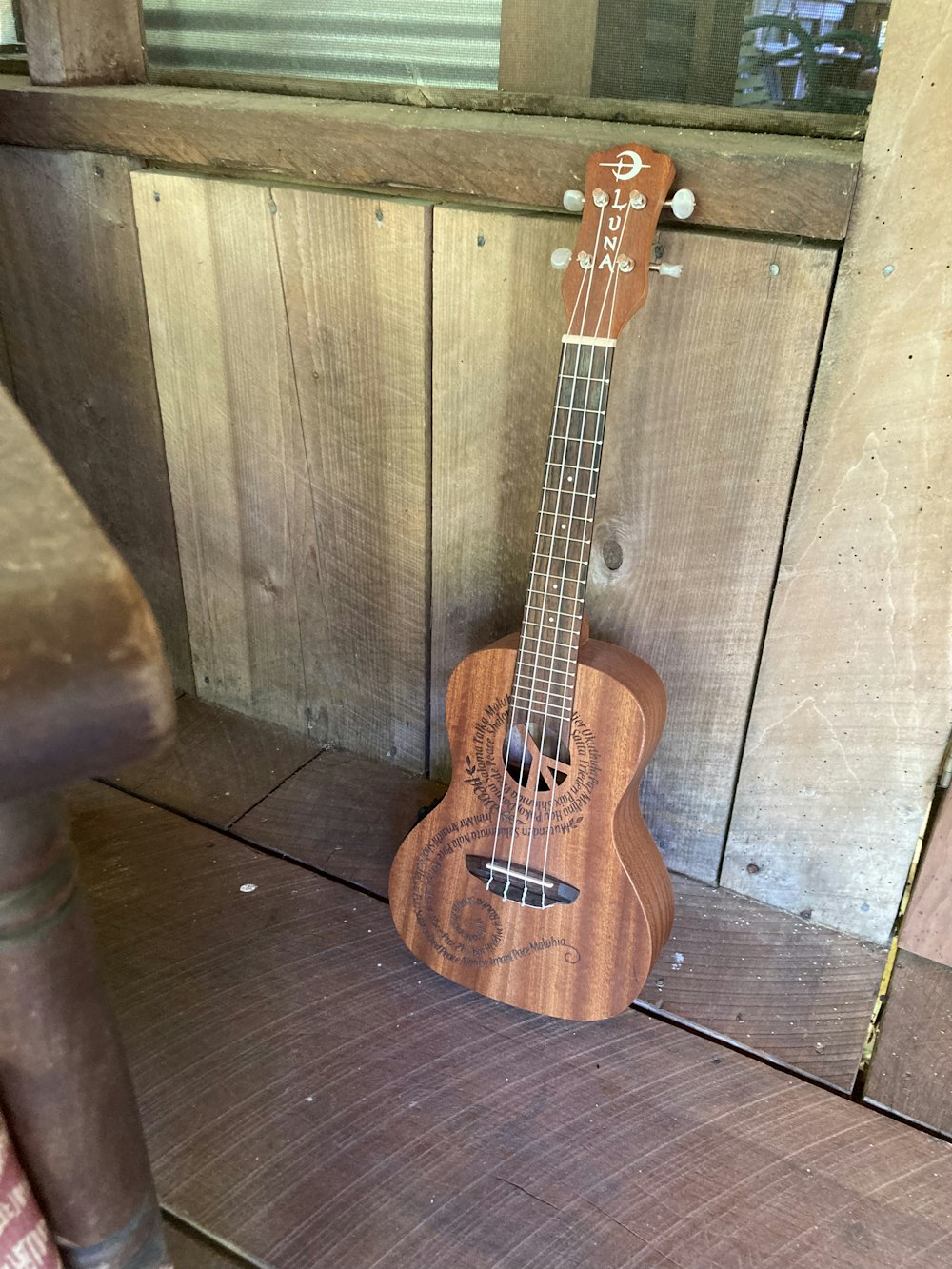 a guitar leaning against a wall