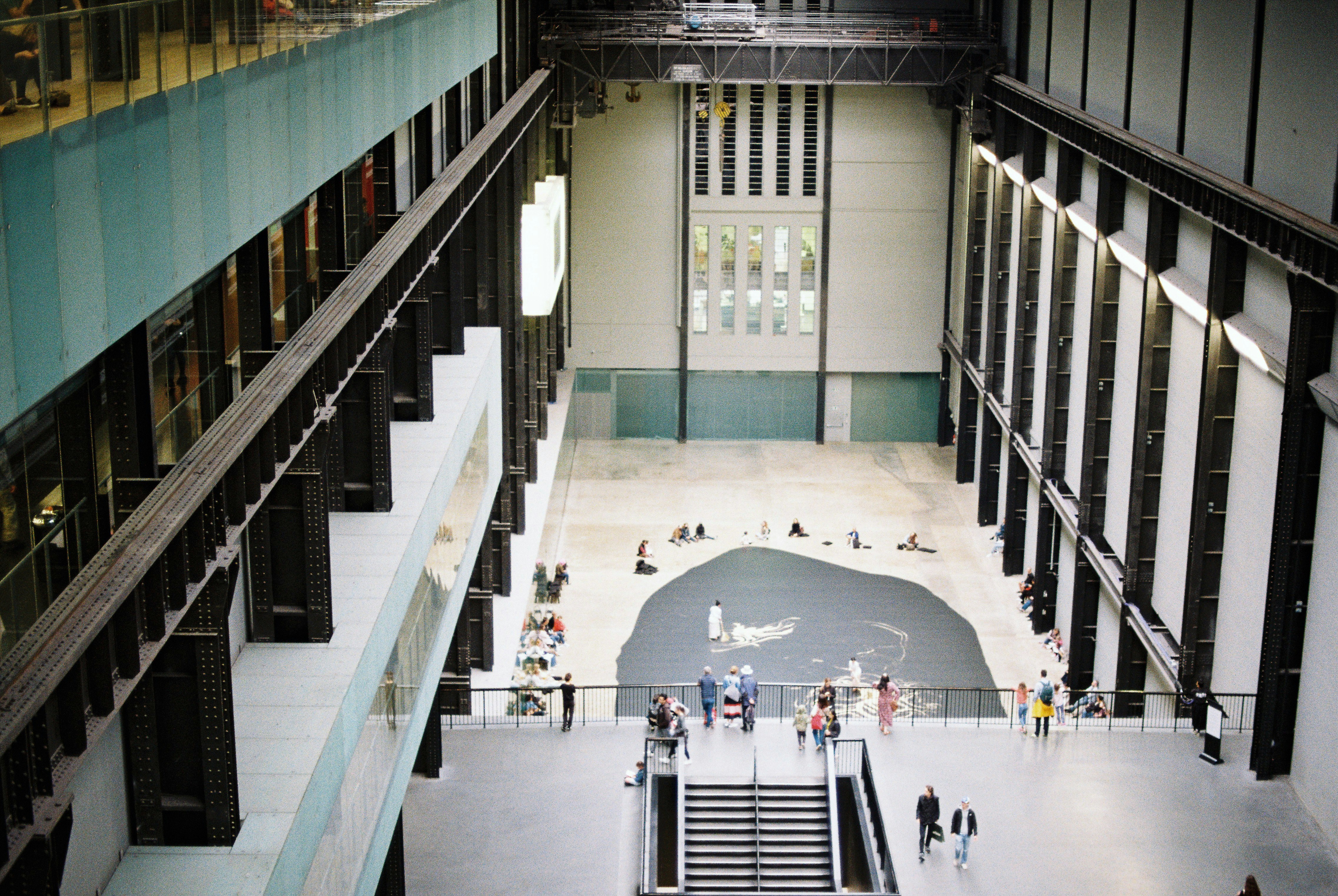 a group of people walking around a building