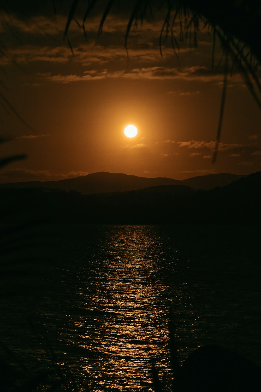 a sunset over a body of water