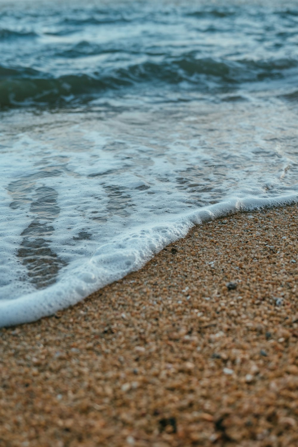 a beach with waves crashing