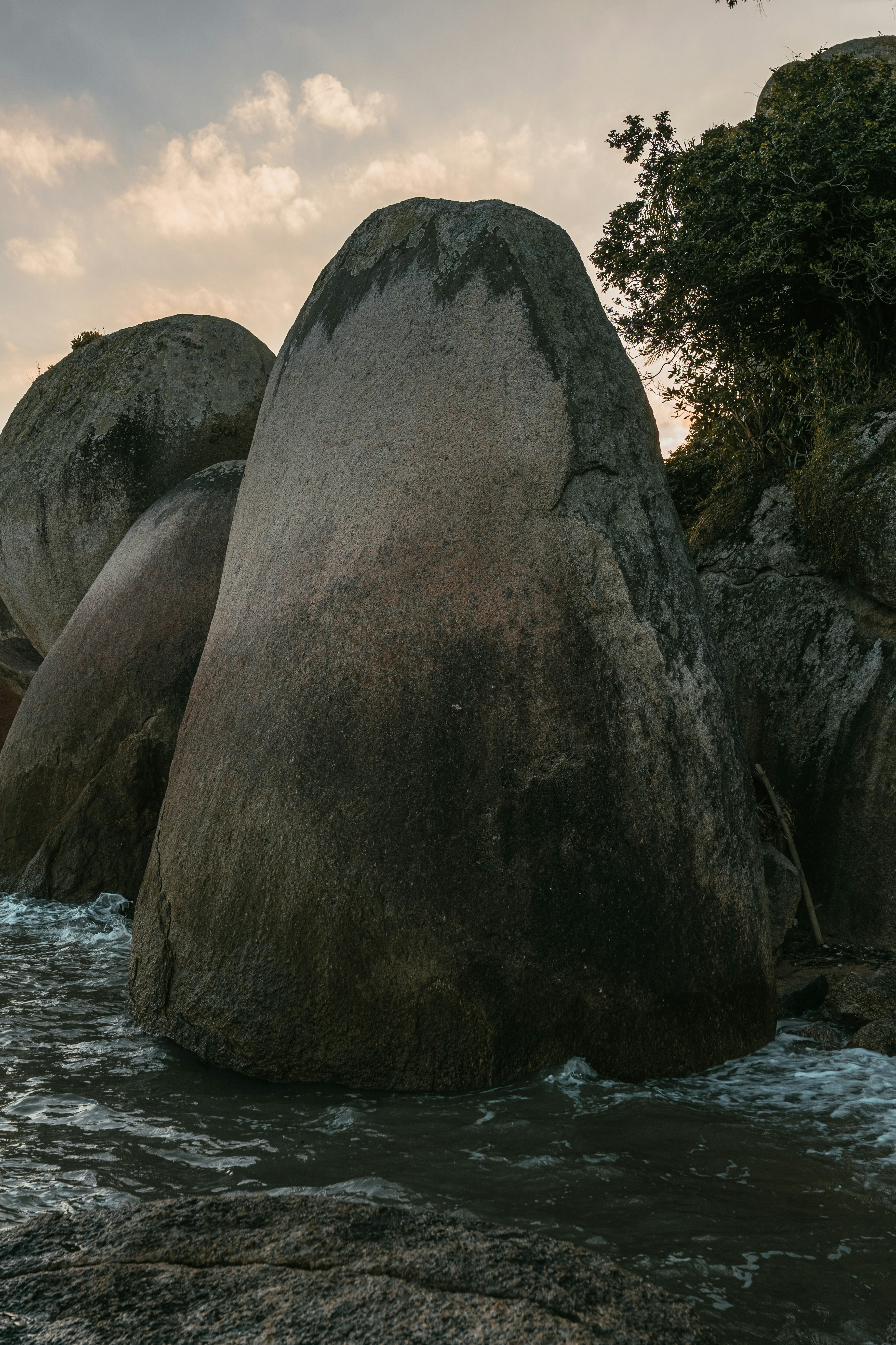a large rock in the water