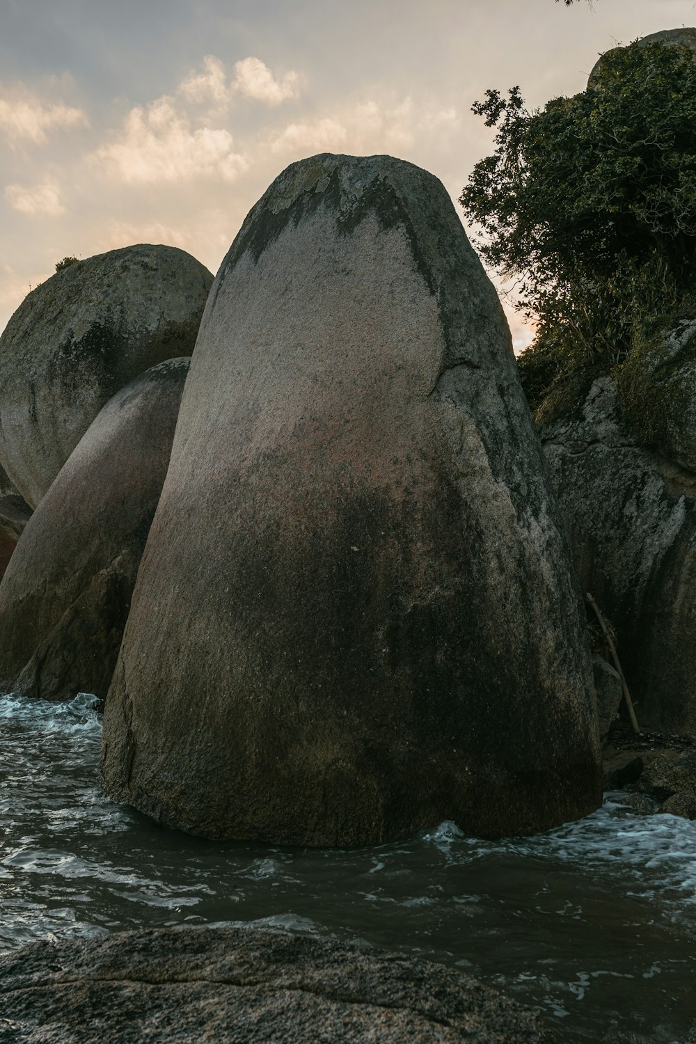 a large rock in the water