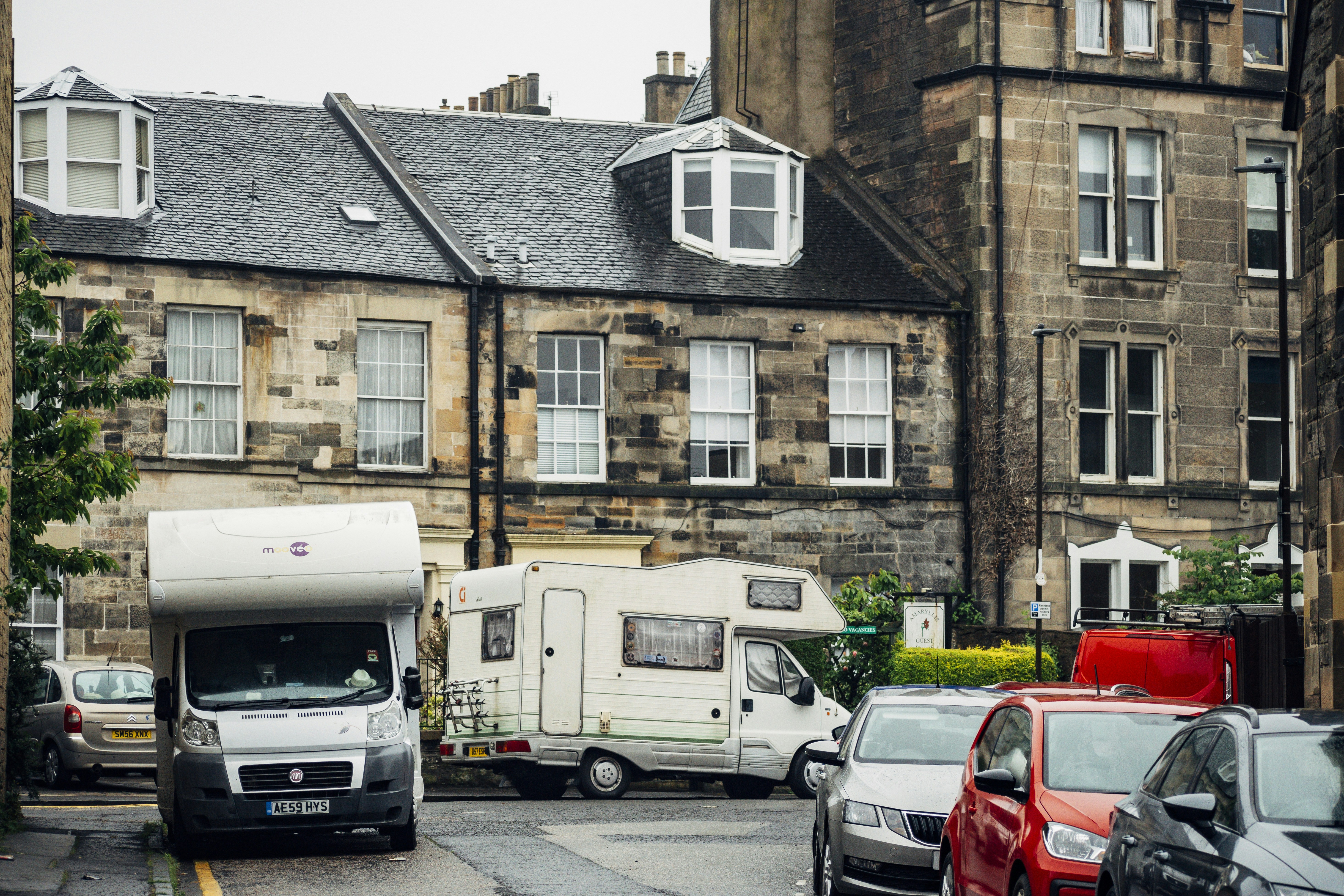 a group of cars parked outside a building