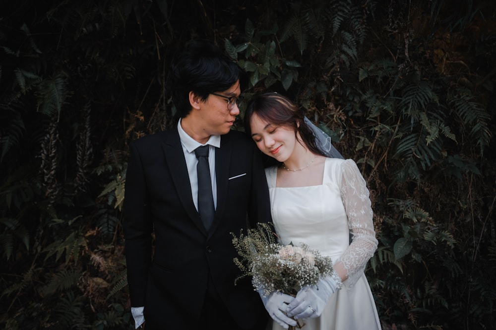 a man and woman in wedding attire