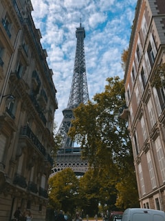a tall pointy tower in a city