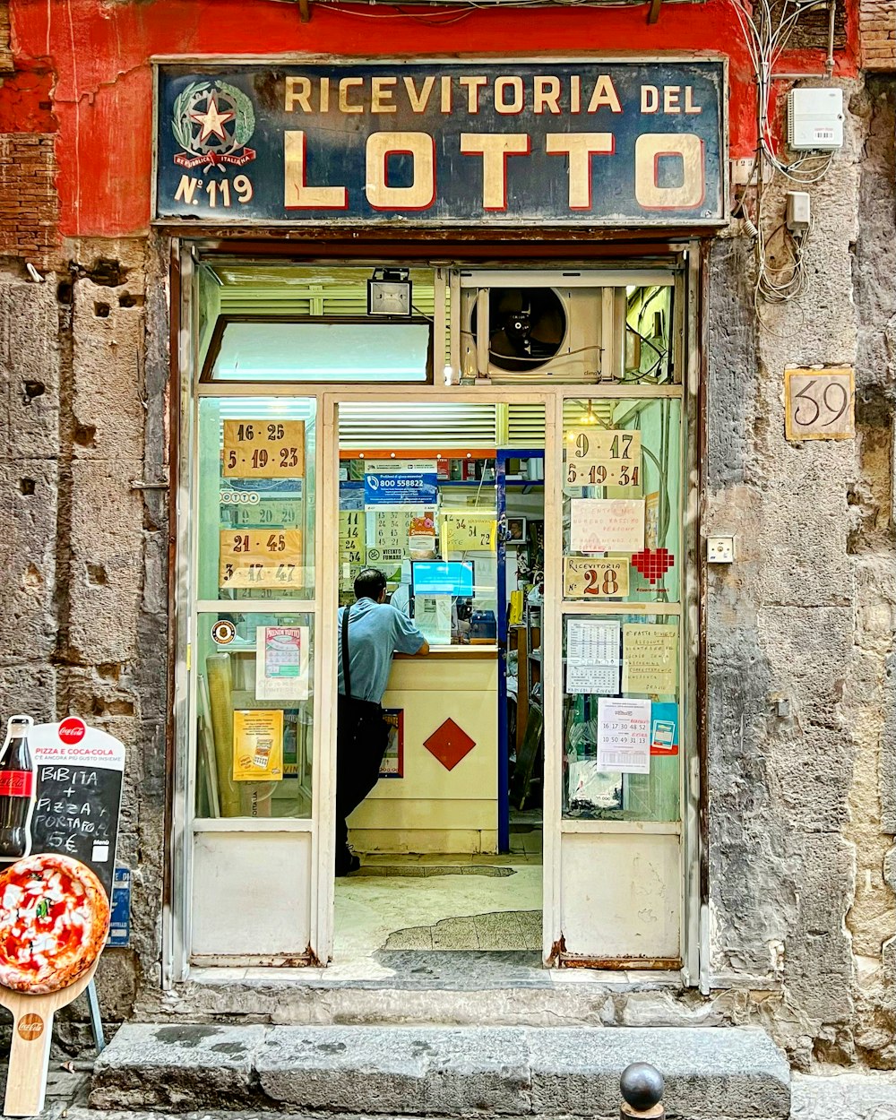 a person standing in a doorway of a building