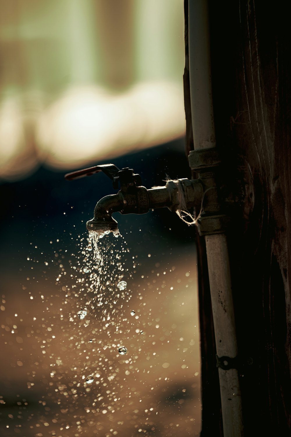 a water faucet on a window