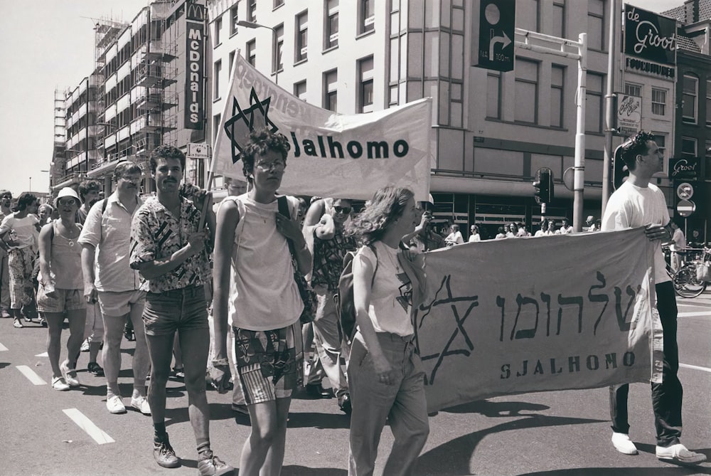 a group of people marching in the street