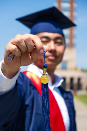 a man wearing a graduation cap and gown