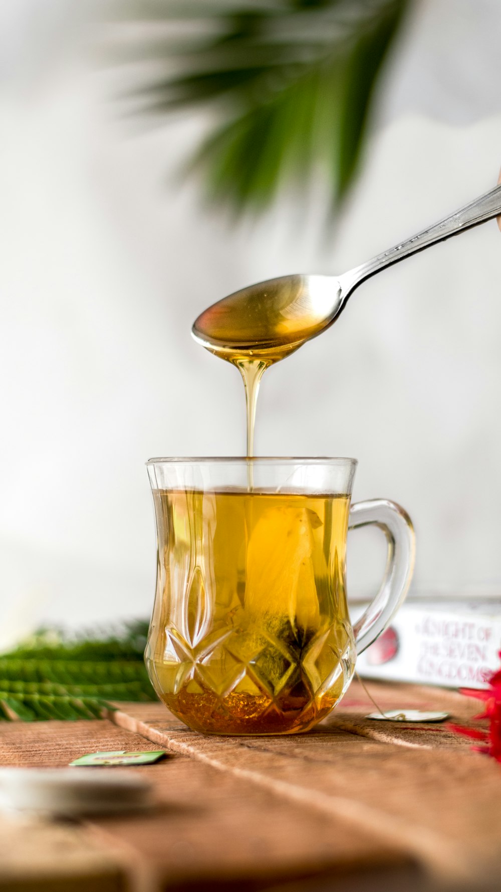 a glass of tea with a spoon