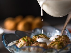 a bowl of food and a glass of wine