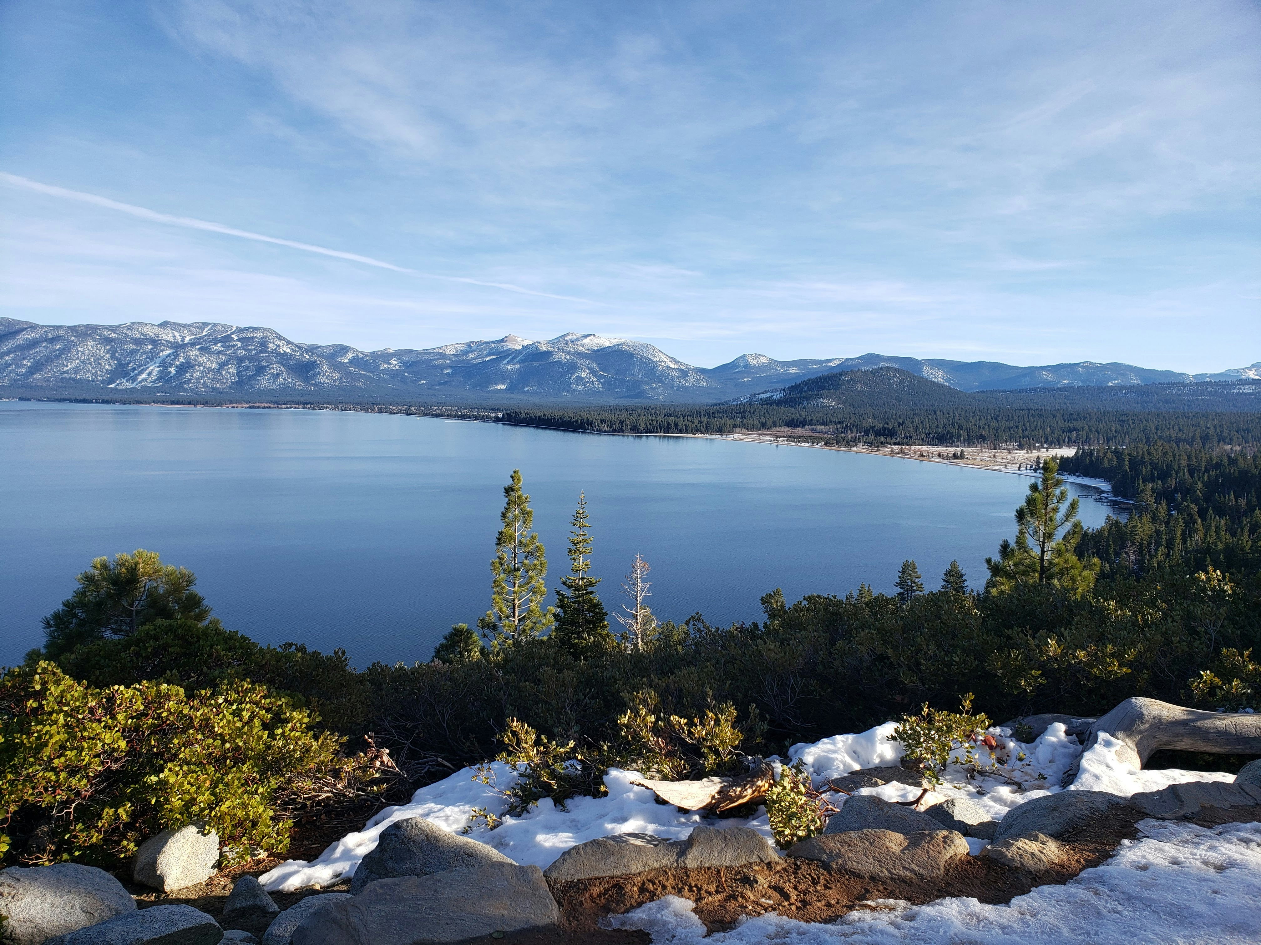 a lake with mountains in the background