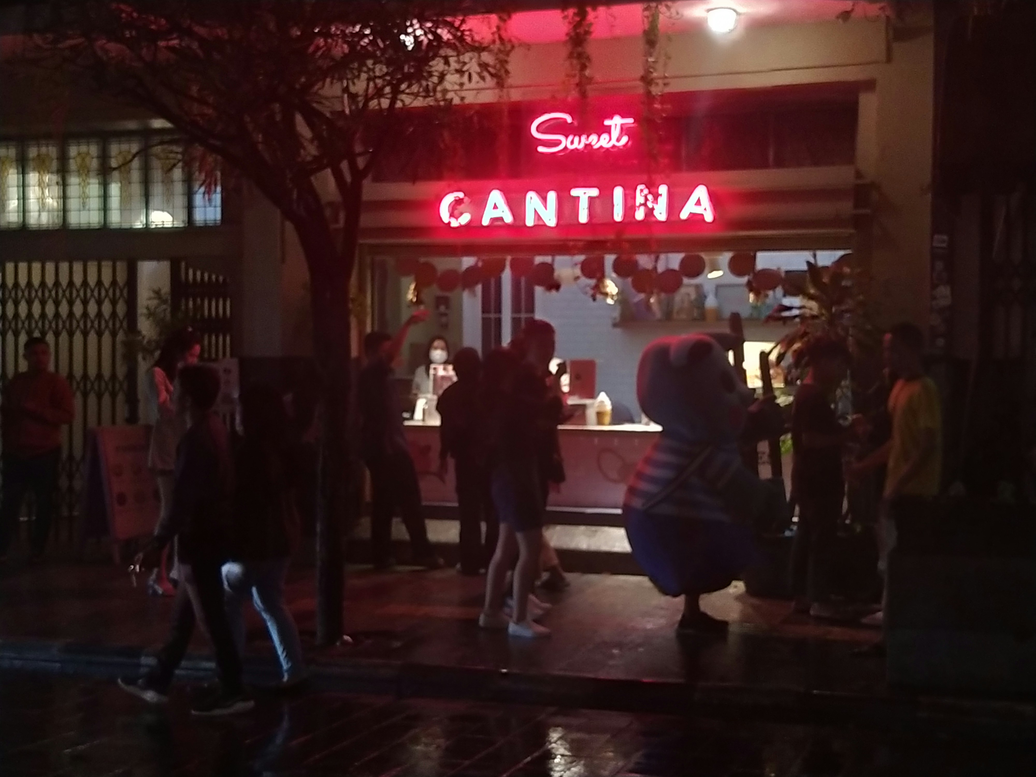 a group of people walking outside a building
