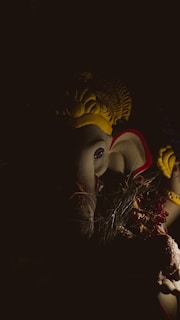 A serene statue of Ganesha with soft natural lighting