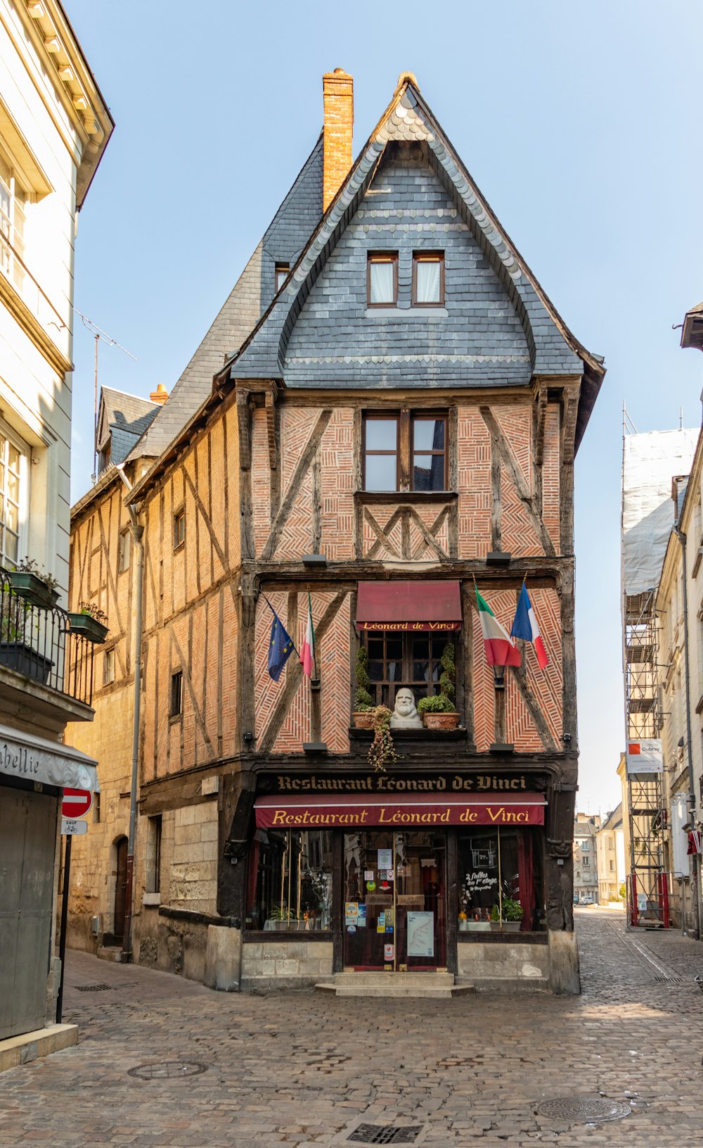 a building with flags on the roof