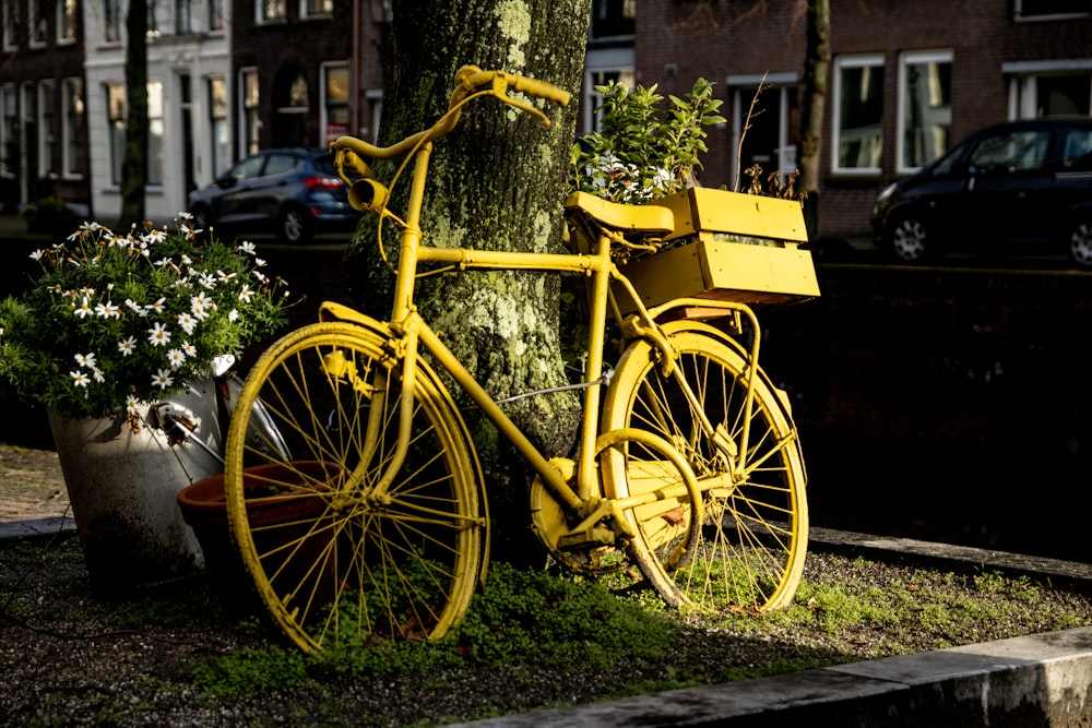 a yellow bicycle with a large wheel