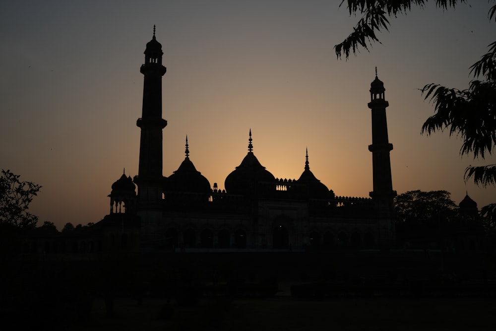 a building with towers at night