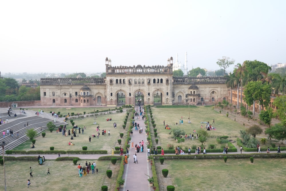 a large stone building with many people in front of it