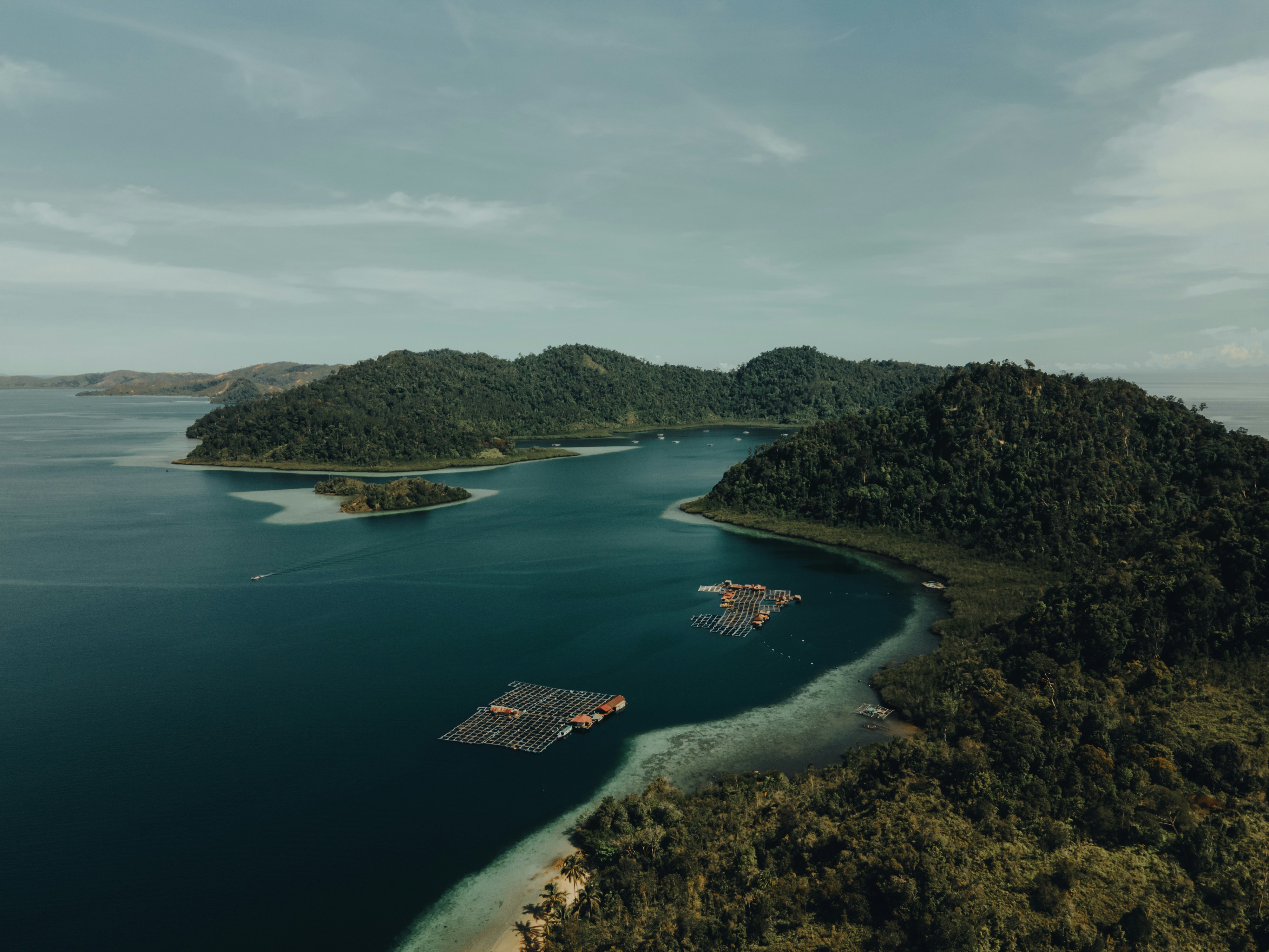 A group of islands surrounded by water photo Free Puncak mandeh Image