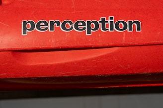 a red car with black text