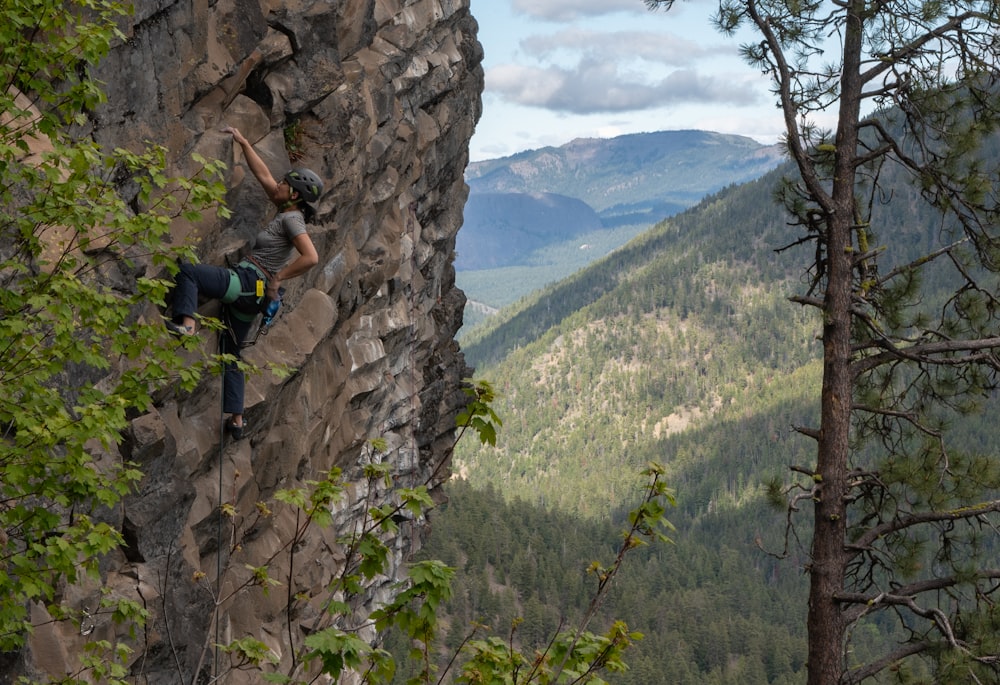 a person climbing a rock