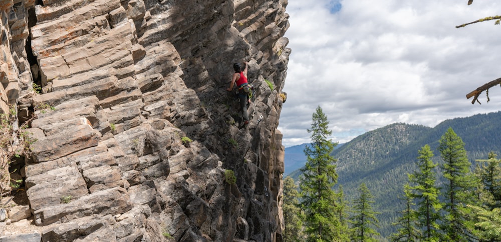 a person climbing a rock wall