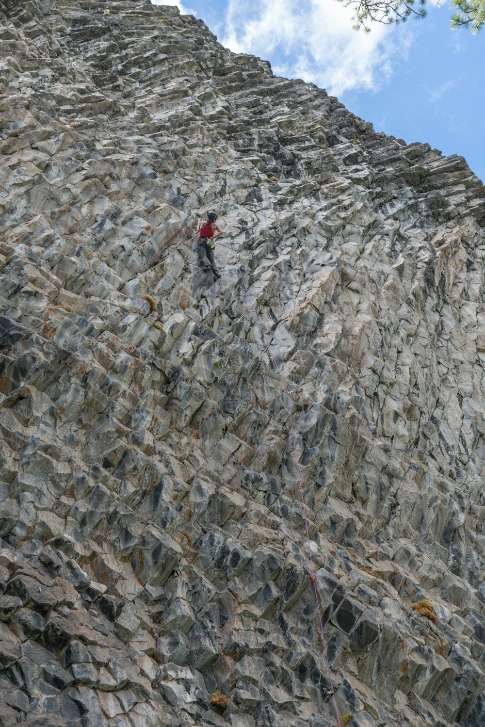 a person climbing a rocky mountain