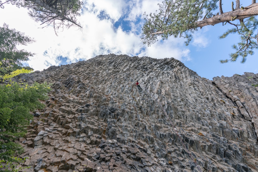 a person climbing a rock wall