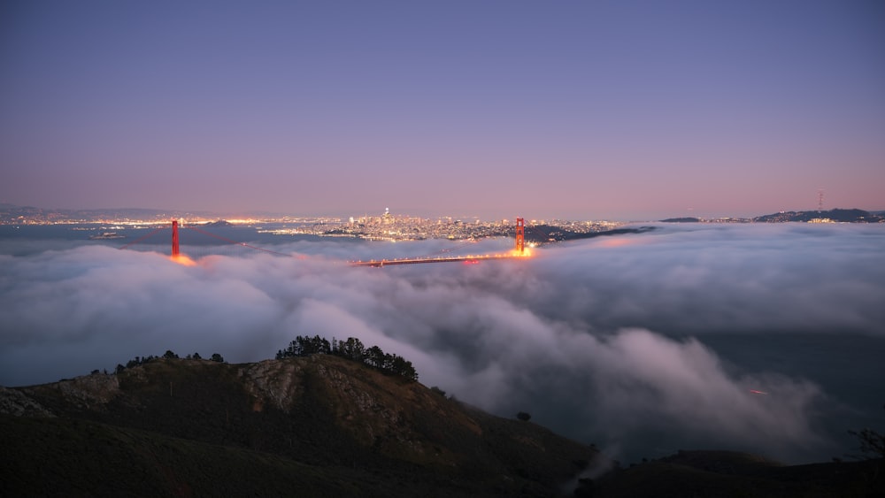 a mountain with a foggy sky