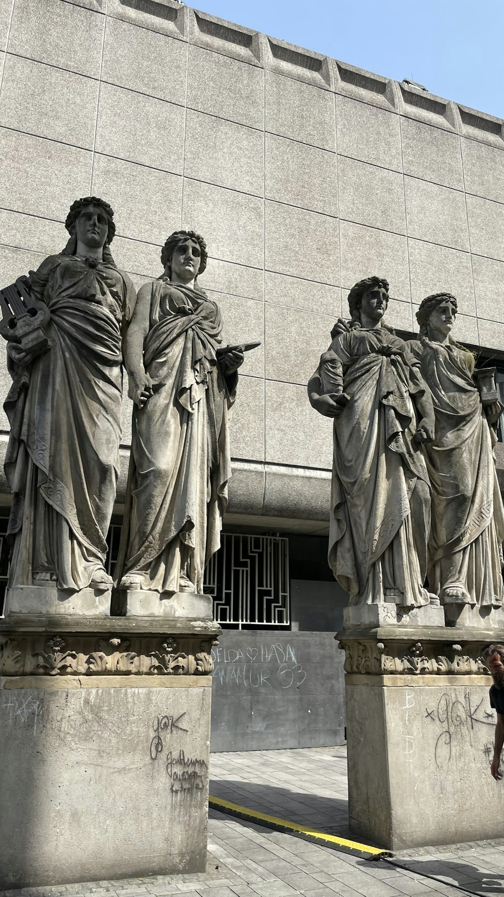 a group of statues outside a building