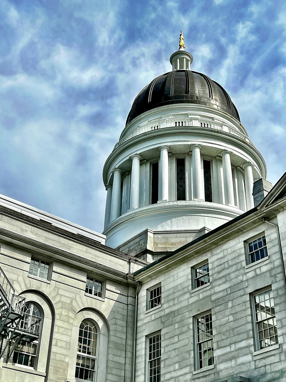 a building with a dome and columns