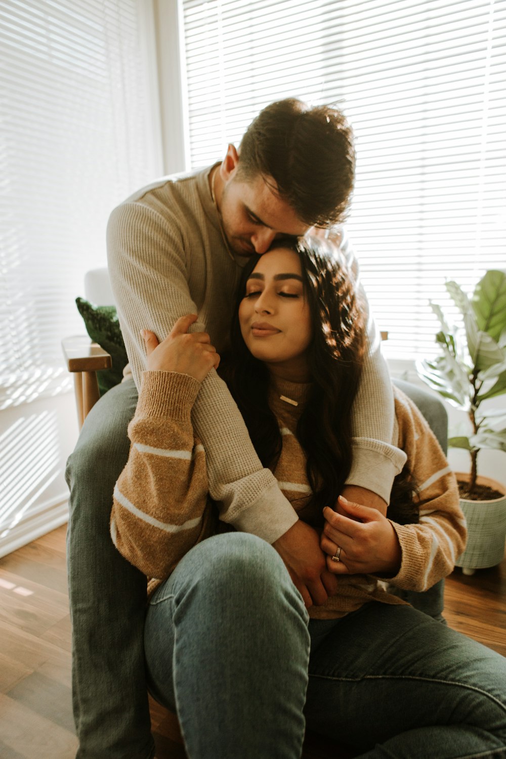 a man and woman sitting on a couch