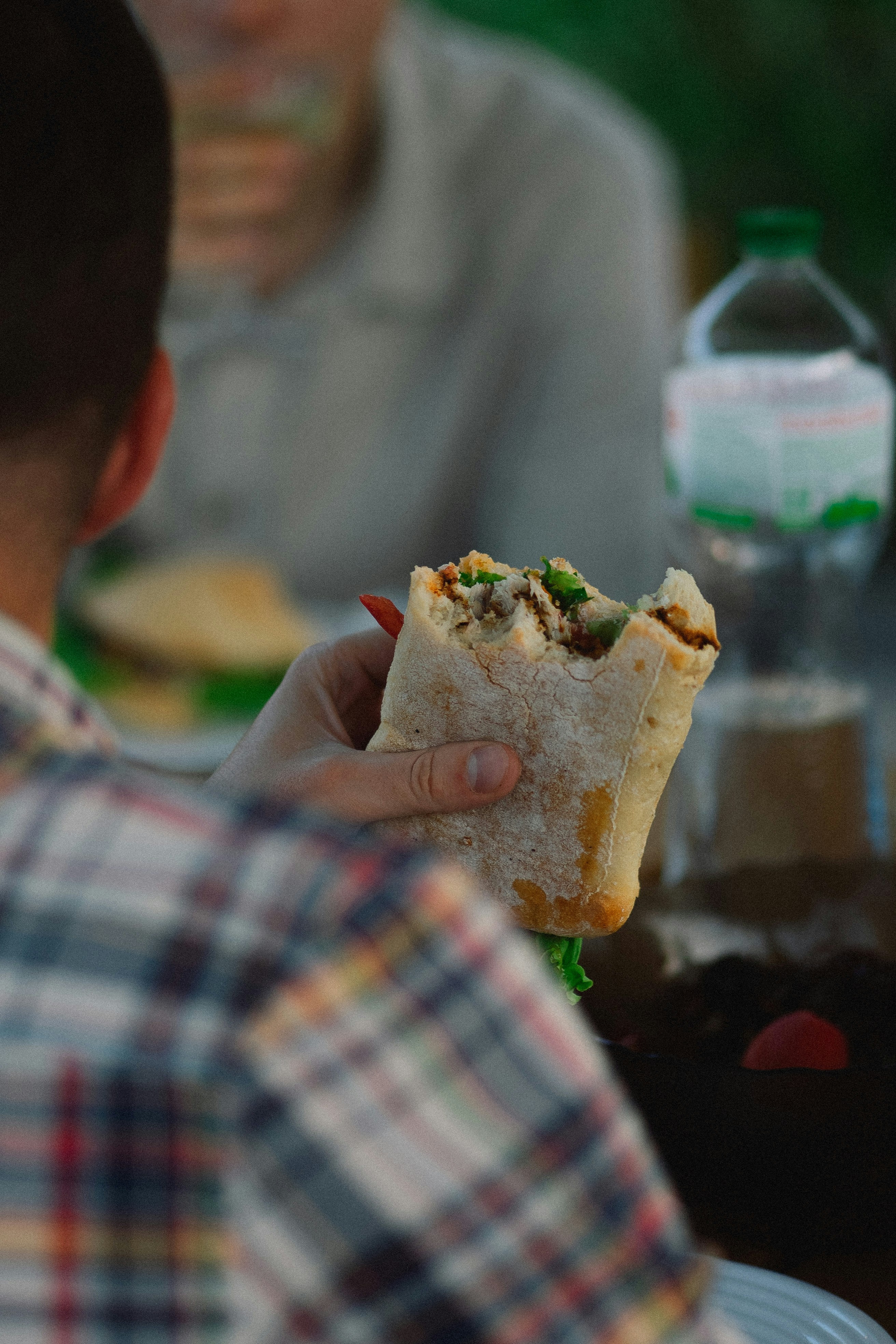 a man holding a sandwich