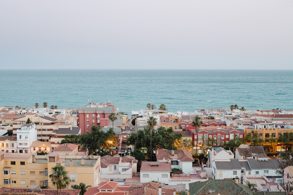 a city with a body of water in the background