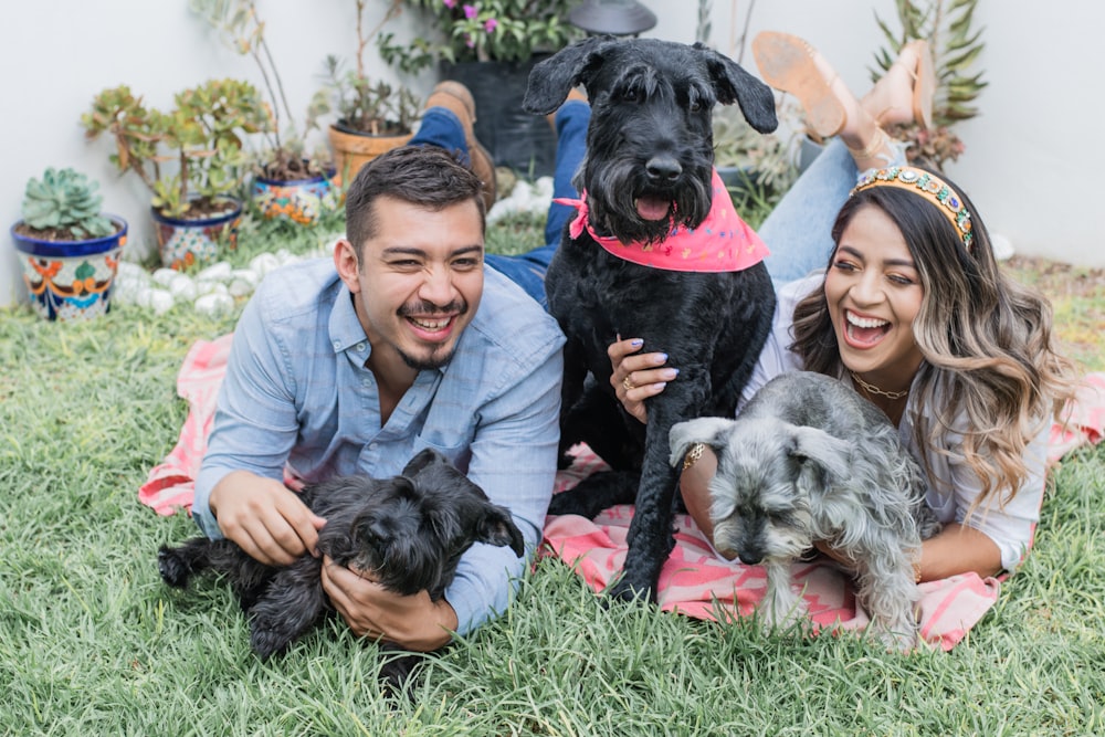 a man and woman with dogs