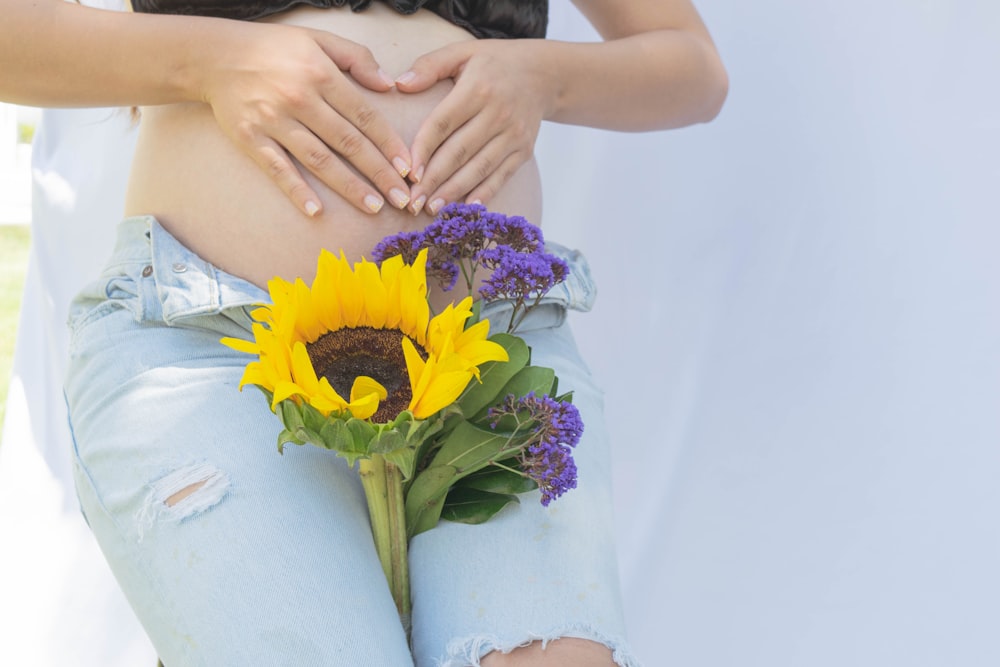 a person holding a bouquet of flowers