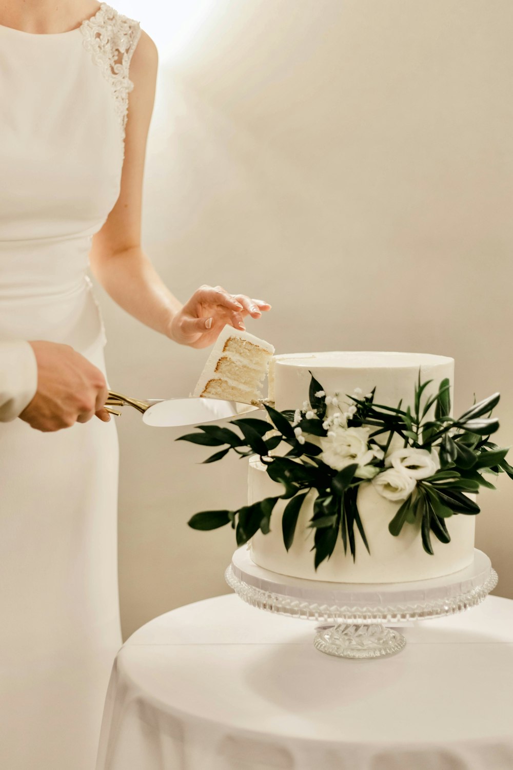 a woman cutting a cake